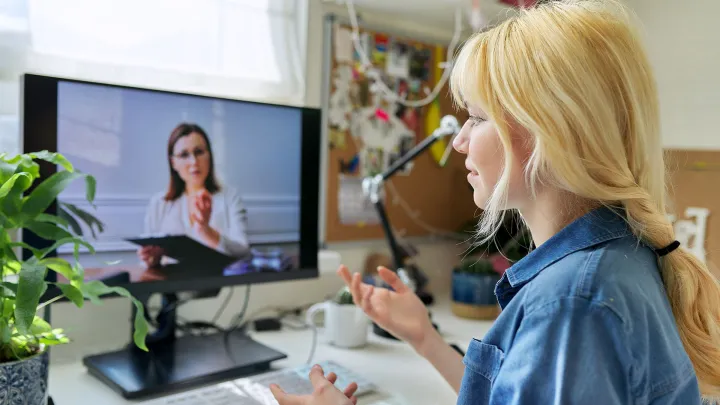 Student having a video meeting on a computer